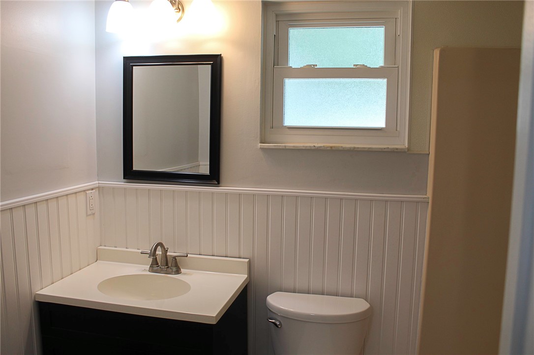 102 Cardinal Drive Sebastian, FL 32958 - Photo 23 of 34 a bathroom with a sink a mirror and a toilet
