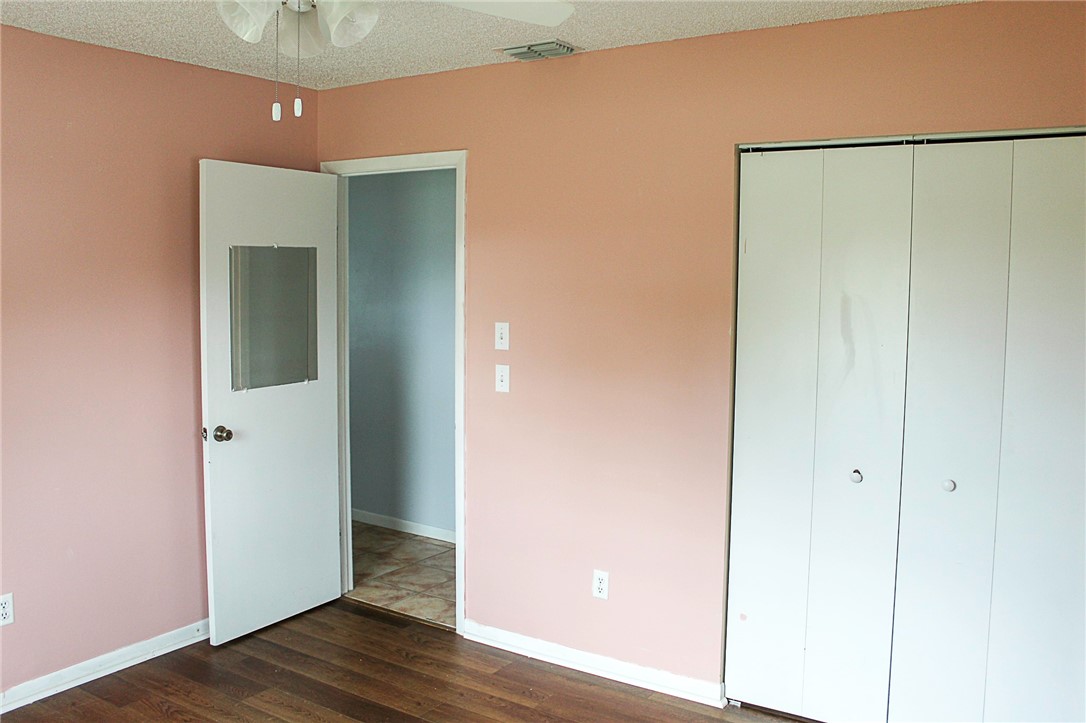 102 Cardinal Drive Sebastian, FL 32958 - Photo 26 of 34 a view of an empty room with wooden floor