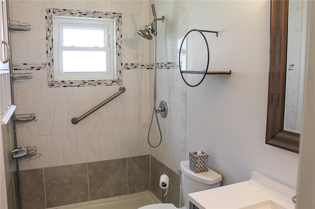 102 Cardinal Drive Sebastian, FL 32958 - Photo 28 of 34 a bathroom with a granite countertop toilet a sink and a mirror