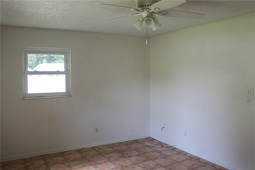 102 Cardinal Drive Sebastian, FL 32958 - Photo 30 of 34 an empty room with a window