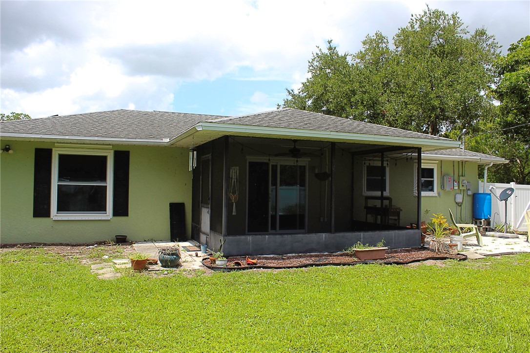 102 Cardinal Drive Sebastian, FL 32958 - Photo 6 of 34 a front view of a house with a yard