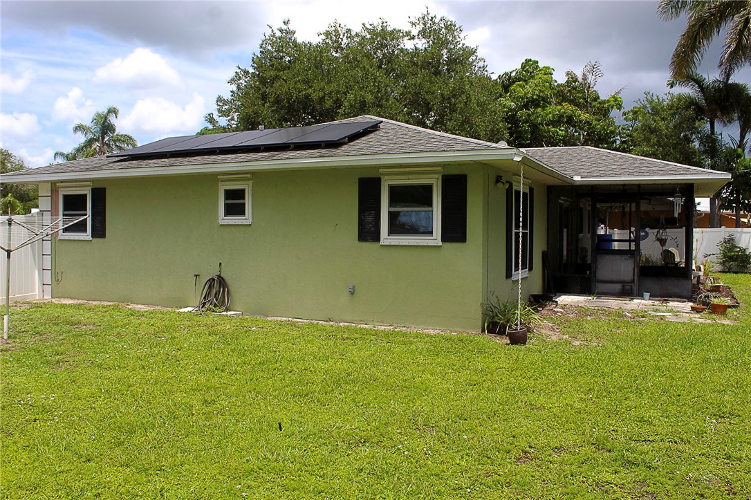 102 Cardinal Drive Sebastian, FL 32958 - Photo 10 of 34 a front view of a house with a yard