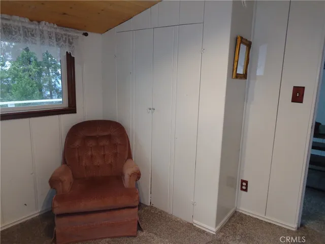 a bench sitting in middle of a closet