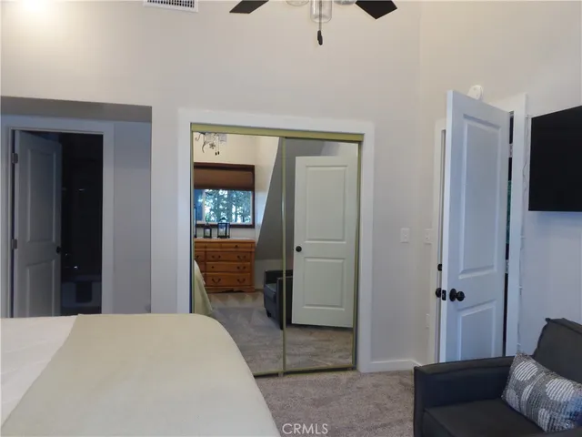 a bedroom with a bed and furniture