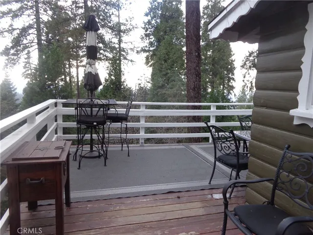 a view of chairs and tables in the balcony
