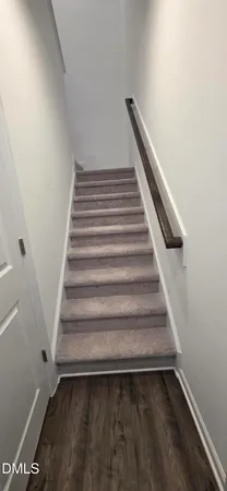 a view of a closet area with ceiling fan