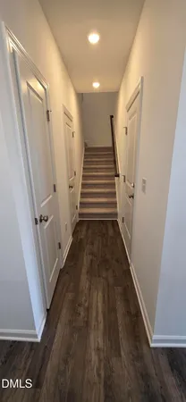 a kitchen with granite countertop a sink cabinets and a window