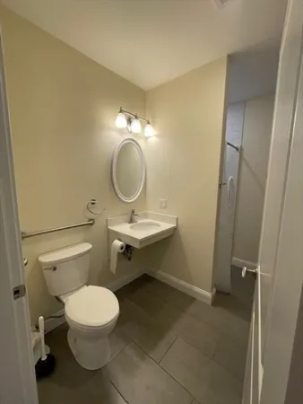 a bathroom with a glass shower door