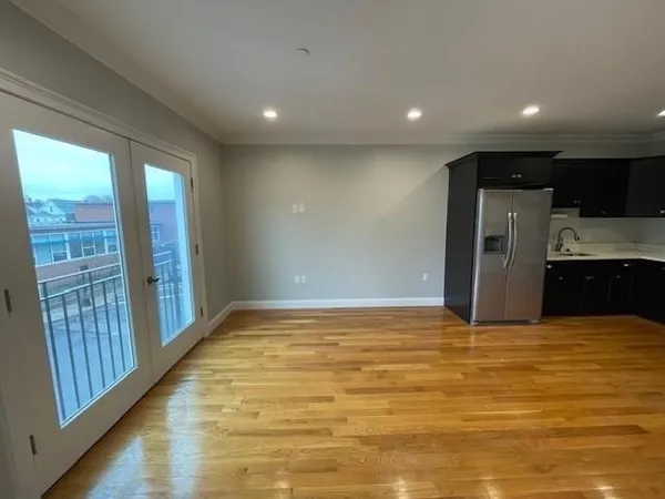 a view of gallery with wooden floor