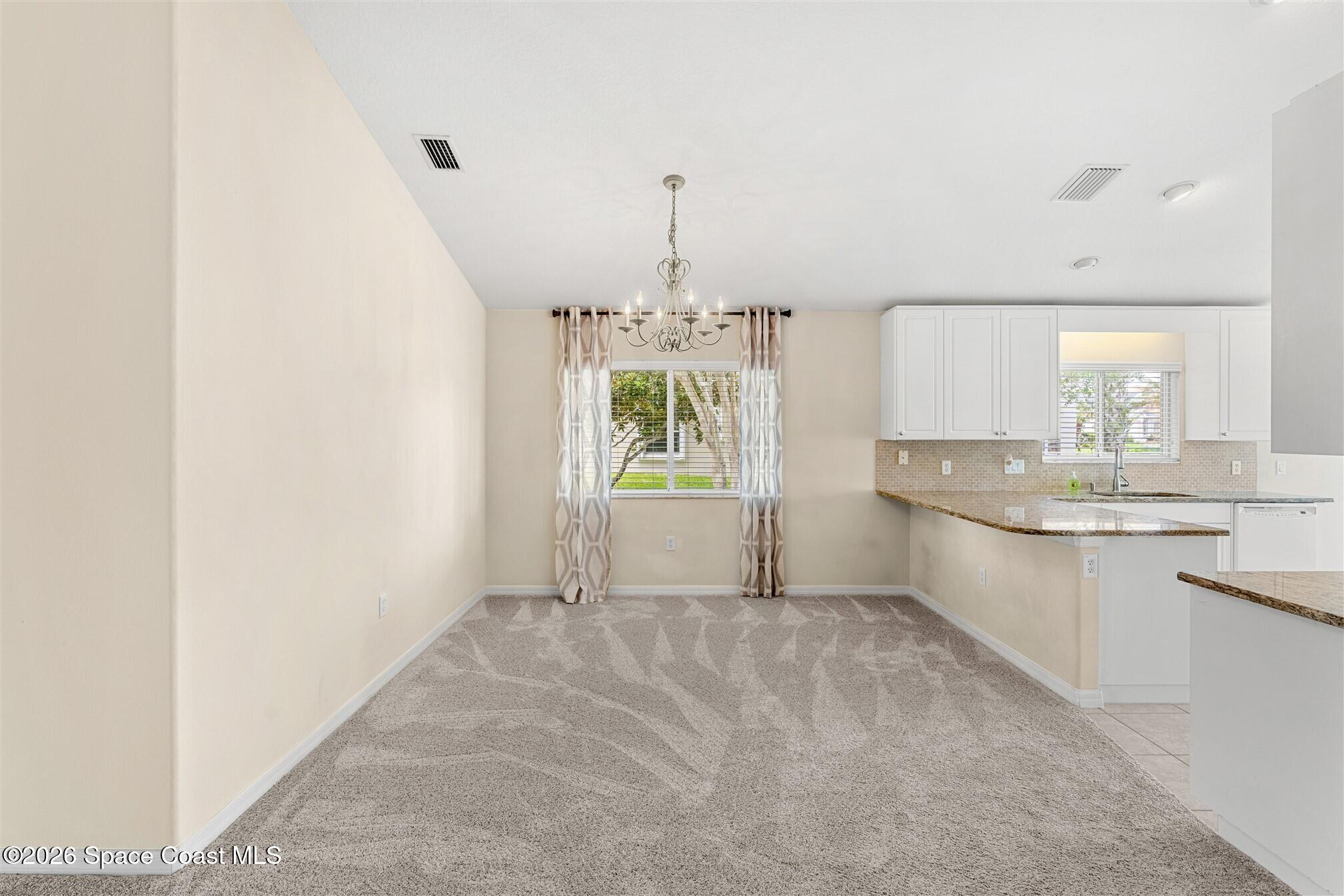 6904 Renshaw Drive Melbourne, FL 32940 - Photo 11 of 46 a bathroom with a sink and a mirror