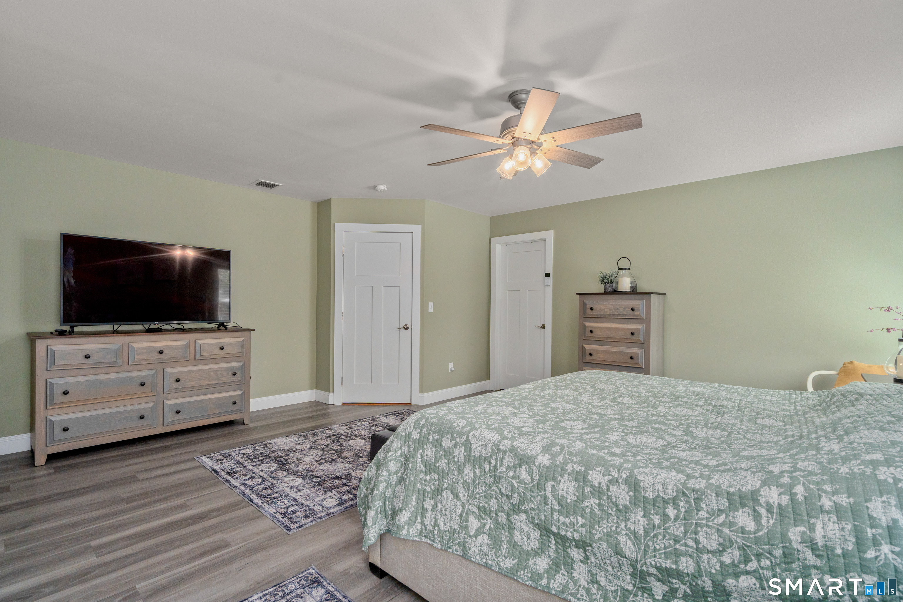 5 Limric Lane Suffield, CT 06078 - Photo 19 of 36 a bedroom with a bed and flat screen tv