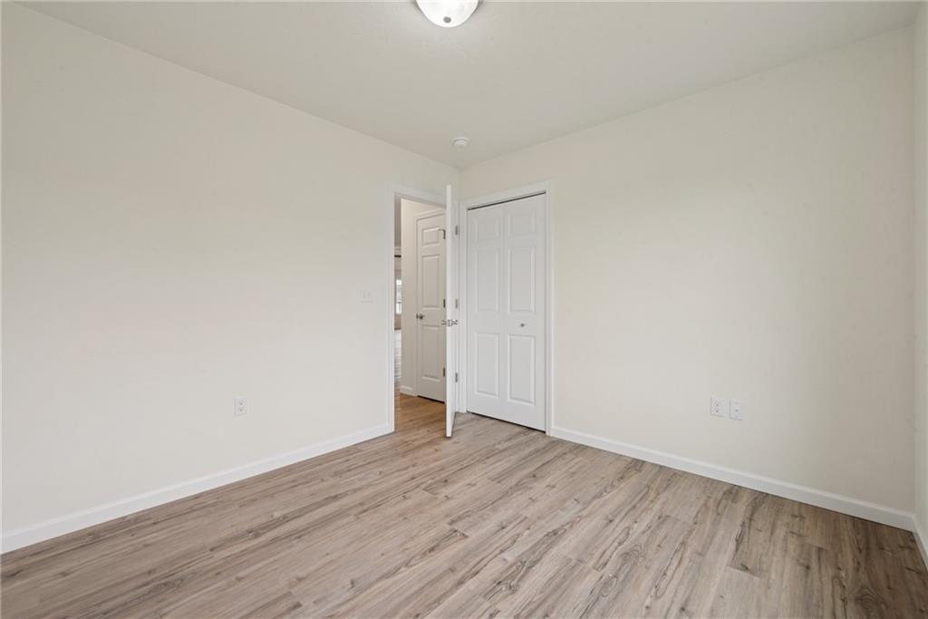 1632 Lois Road, Unit LOT 22 A Latrobe, PA 15650 - Photo 18 of 31 a view of an empty room with wooden floor