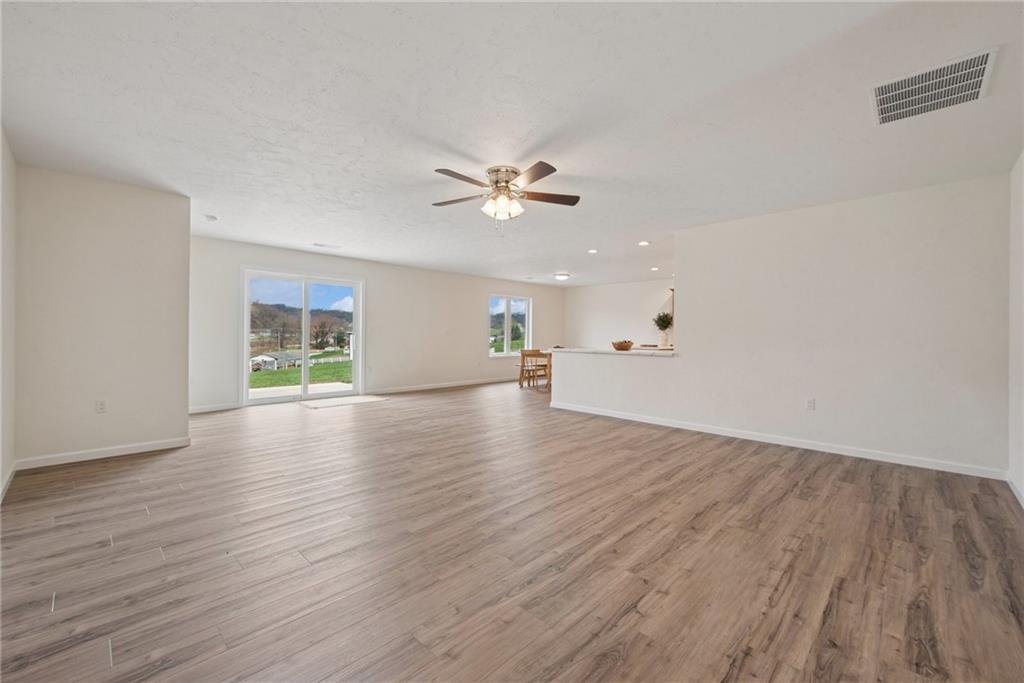 1632 Lois Road, Unit LOT 22 A Latrobe, PA 15650 - Photo 22 of 31 wooden floor in an empty room with a window