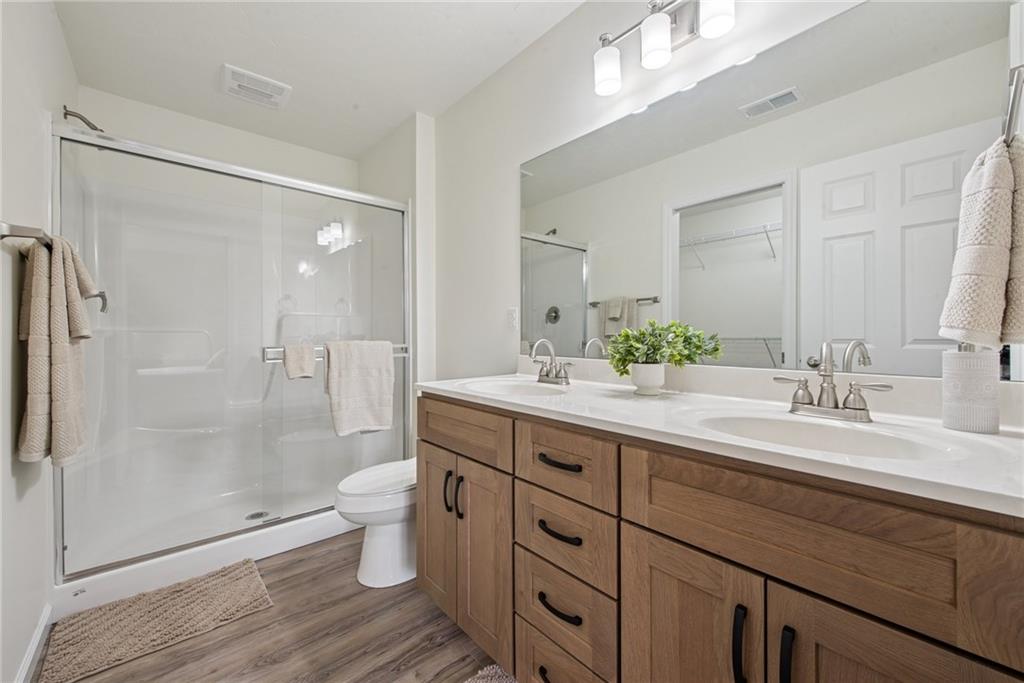 1632 Lois Road, Unit LOT 22 A Latrobe, PA 15650 - Photo 28 of 31 a bathroom with a double vanity sink mirror and toilet