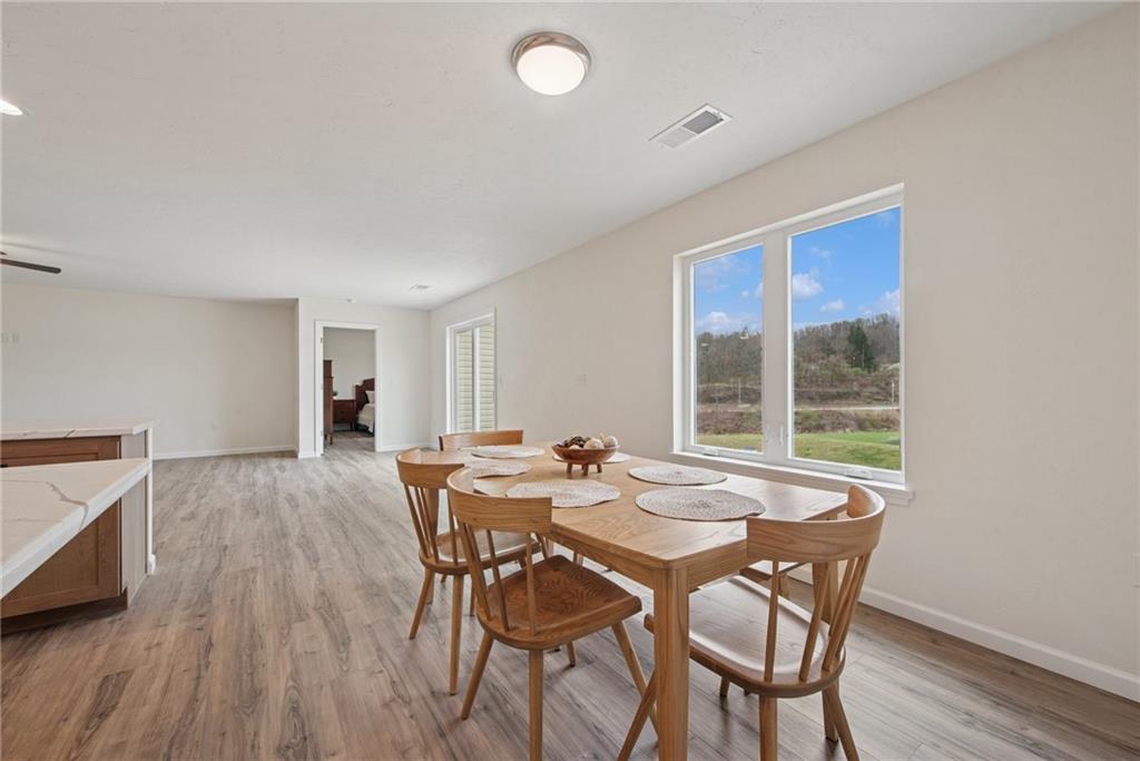 1632 Lois Road, Unit LOT 22 A Latrobe, PA 15650 - Photo 10 of 31 a view of a dining room with furniture and wooden floor