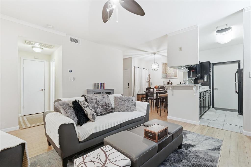 5619 Preston Oaks Road, Unit 305 Dallas, TX 75254 - Photo 14 of 35 a living room with furniture and a refrigerator