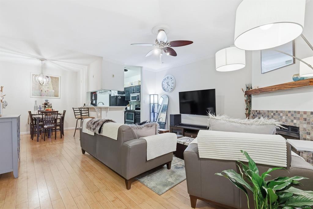 5619 Preston Oaks Road, Unit 305 Dallas, TX 75254 - Photo 16 of 35 a living room with furniture and a flat screen tv