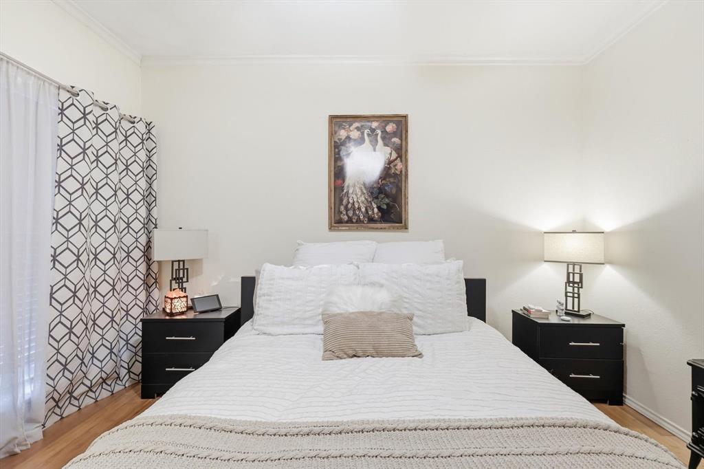 5619 Preston Oaks Road, Unit 305 Dallas, TX 75254 - Photo 19 of 35 a bedroom with a bed and a lamp