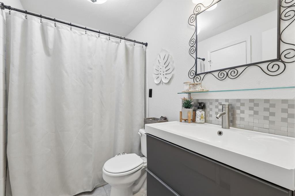 5619 Preston Oaks Road, Unit 305 Dallas, TX 75254 - Photo 23 of 35 a bathroom with a sink and a mirror