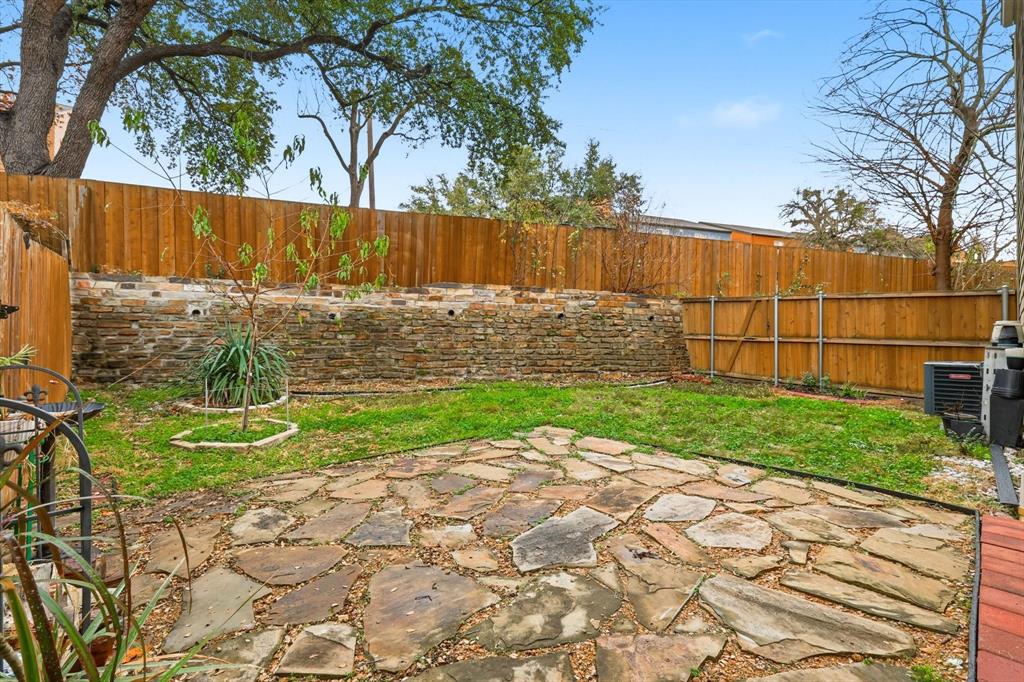 5619 Preston Oaks Road, Unit 305 Dallas, TX 75254 - Photo 25 of 35 a view of backyard with wooden fence