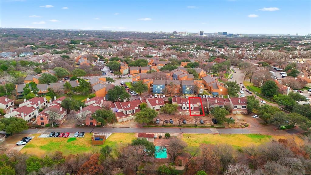 5619 Preston Oaks Road, Unit 305 Dallas, TX 75254 - Photo 29 of 35 an aerial view of residential houses with outdoor space and trees