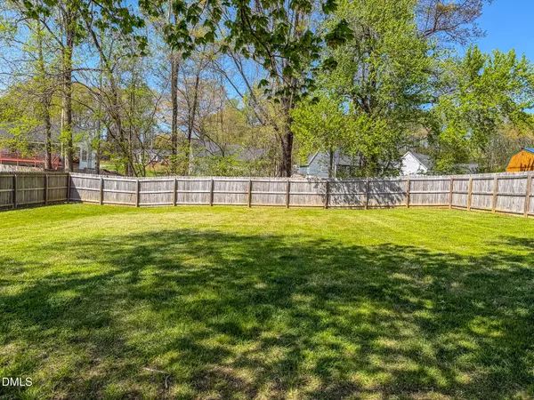 a swimming pool with outdoor seating and yard