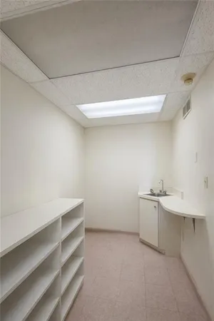 a kitchen with a refrigerator and cabinets