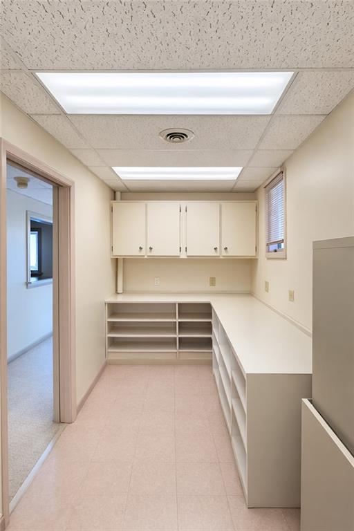 235 Longfellow Street Vandergrift, PA 15690 - Photo 6 of 8 a kitchen with a refrigerator and cabinets