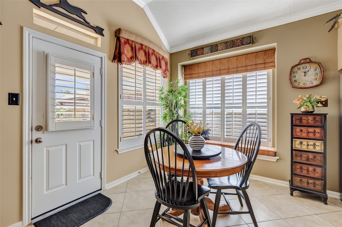 25605 Dartmaker Court Porter, TX 77365 - Photo 16 of 34 a view of a dining room with furniture and a large window