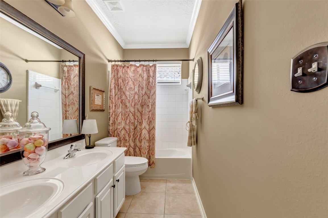 25605 Dartmaker Court Porter, TX 77365 - Photo 19 of 34 a bathroom with a double vanity sink toilet and shower