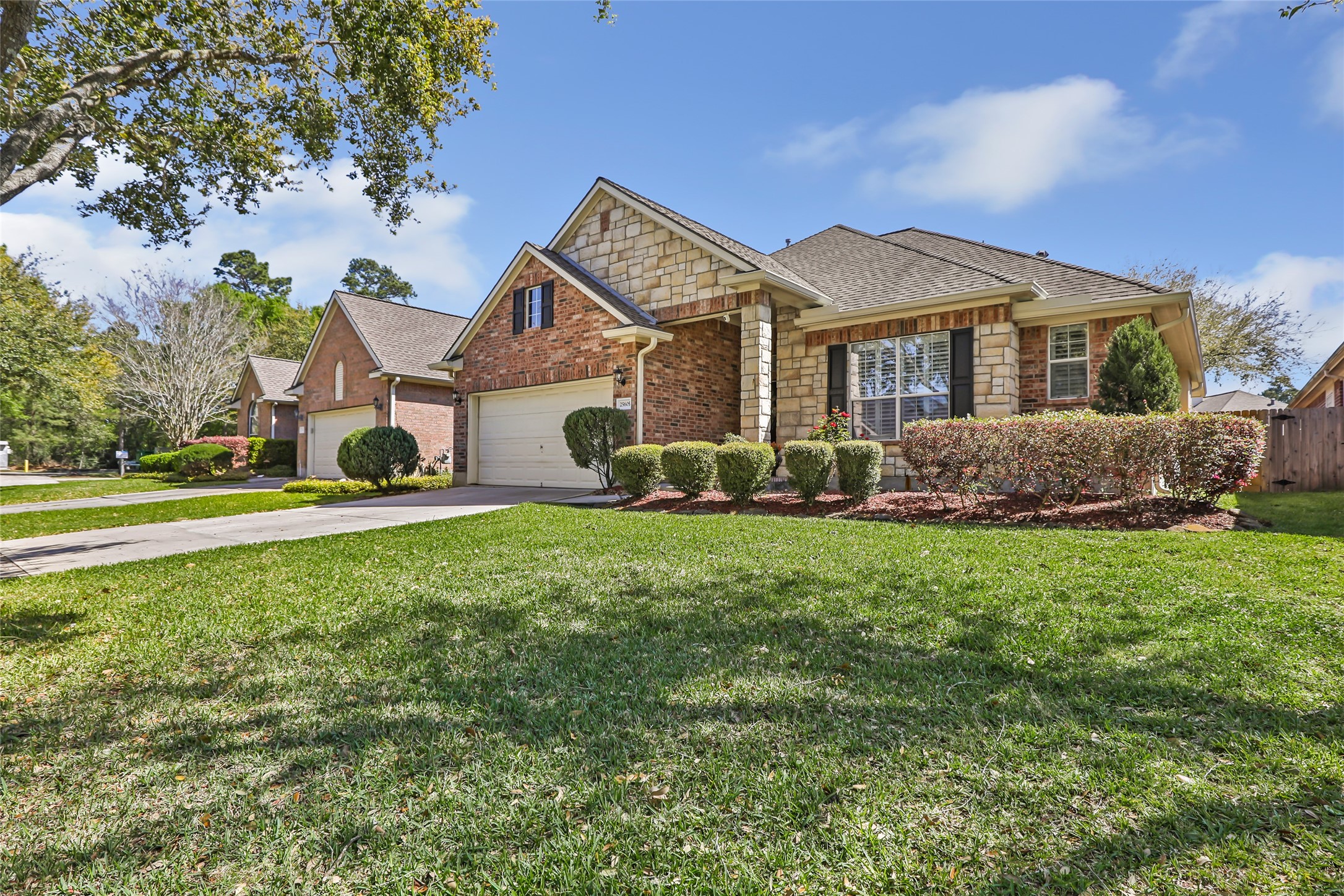 25605 Dartmaker Court Porter, TX 77365 - Photo 2 of 34 a front view of a house with a yard
