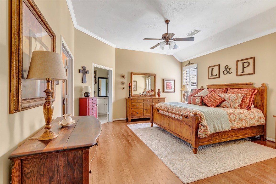 25605 Dartmaker Court Porter, TX 77365 - Photo 21 of 34 a spacious bedroom with a bed window and a table