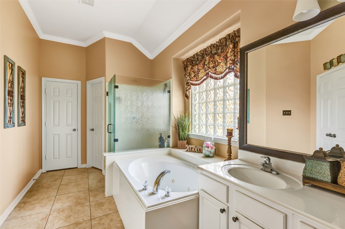 25605 Dartmaker Court Porter, TX 77365 - Photo 26 of 34 a spacious bathroom with a granite countertop sink and a mirror