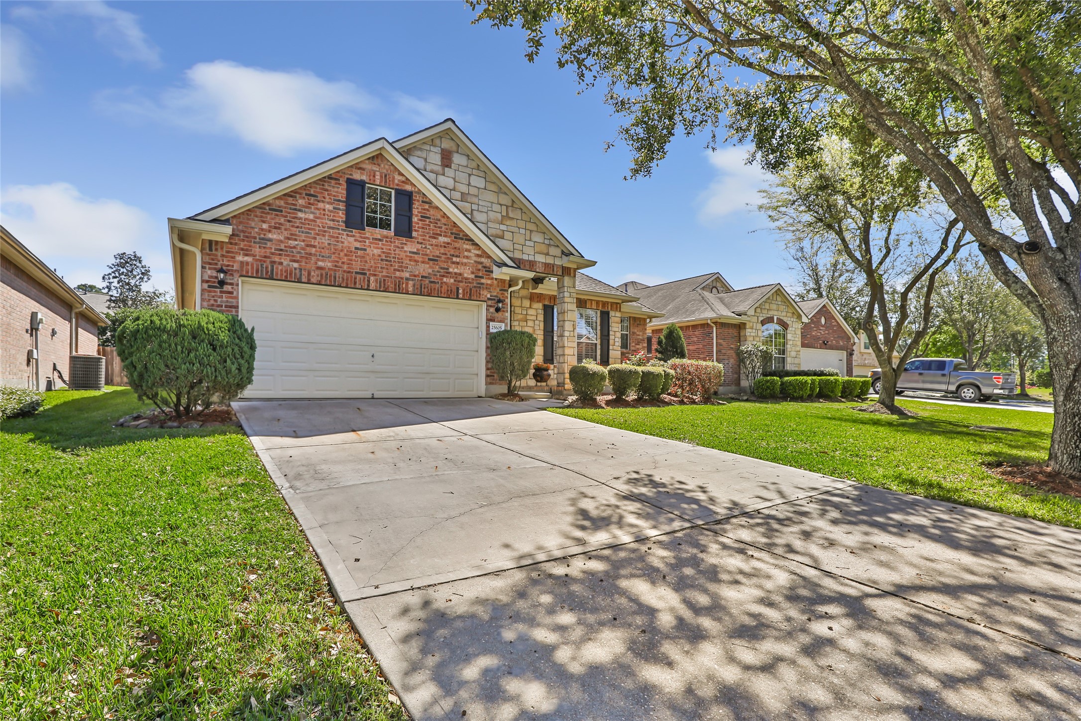 25605 Dartmaker Court Porter, TX 77365 - Photo 3 of 34 a front view of house with yard and green space