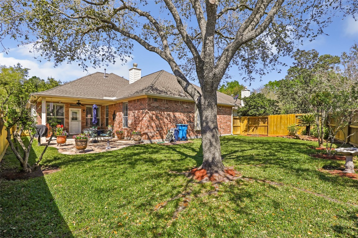 25605 Dartmaker Court Porter, TX 77365 - Photo 31 of 34 a view of a house with backyard and sitting area