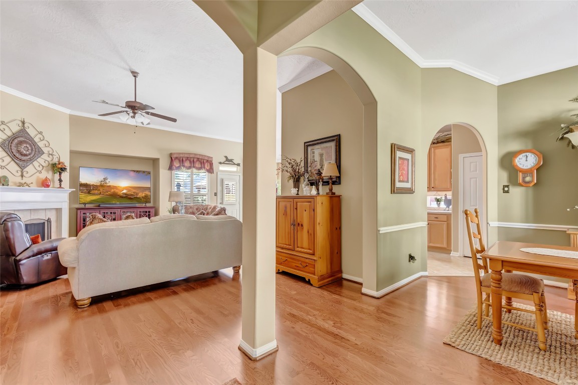 25605 Dartmaker Court Porter, TX 77365 - Photo 5 of 34 a living room with fireplace furniture and a wooden floor