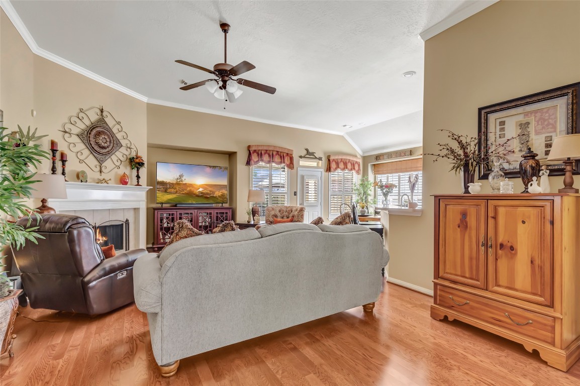 25605 Dartmaker Court Porter, TX 77365 - Photo 6 of 34 a living room with fireplace furniture and a flat screen tv