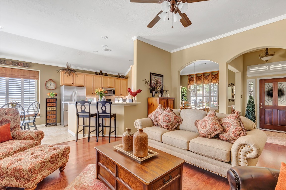 25605 Dartmaker Court Porter, TX 77365 - Photo 7 of 34 a living room with furniture kitchen view and a large window
