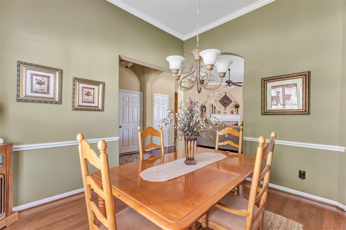 25605 Dartmaker Court Porter, TX 77365 - Photo 10 of 34 a view of a dining room with furniture and chandelier