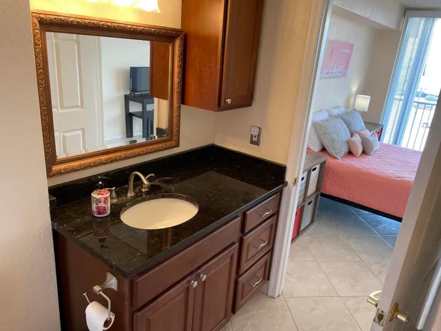 a bathroom with a sink and a mirror