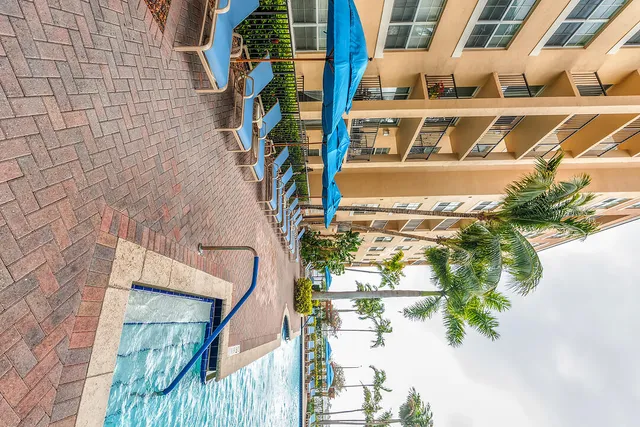 a view of an house with backyard space and sitting area