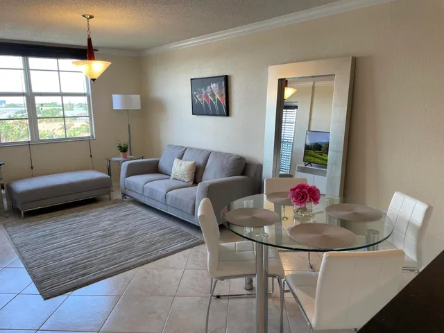 a living room with furniture and a table