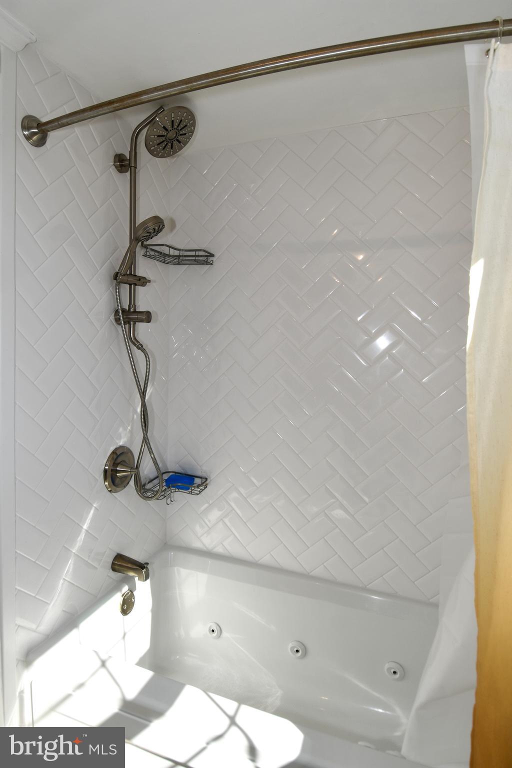 2625 3rd Street Northeast, Unit 301 Washington, DC 20002 - Photo 15 of 21 a bathroom with a shower and a sink