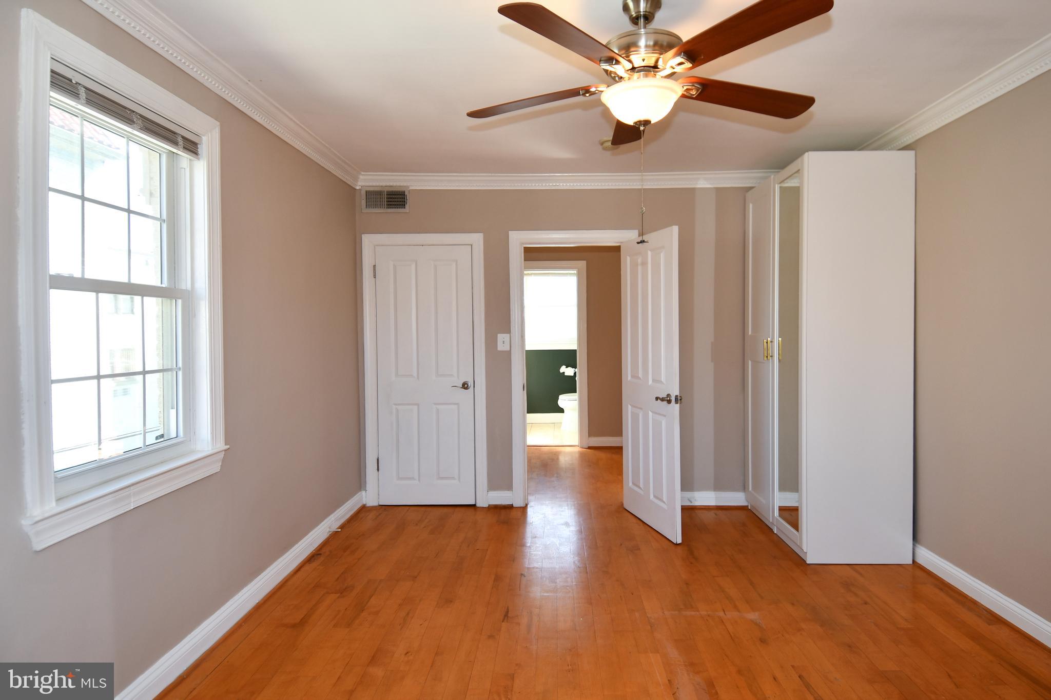 2625 3rd Street Northeast, Unit 301 Washington, DC 20002 - Photo 18 of 21 a view of an empty room with window and wooden floor