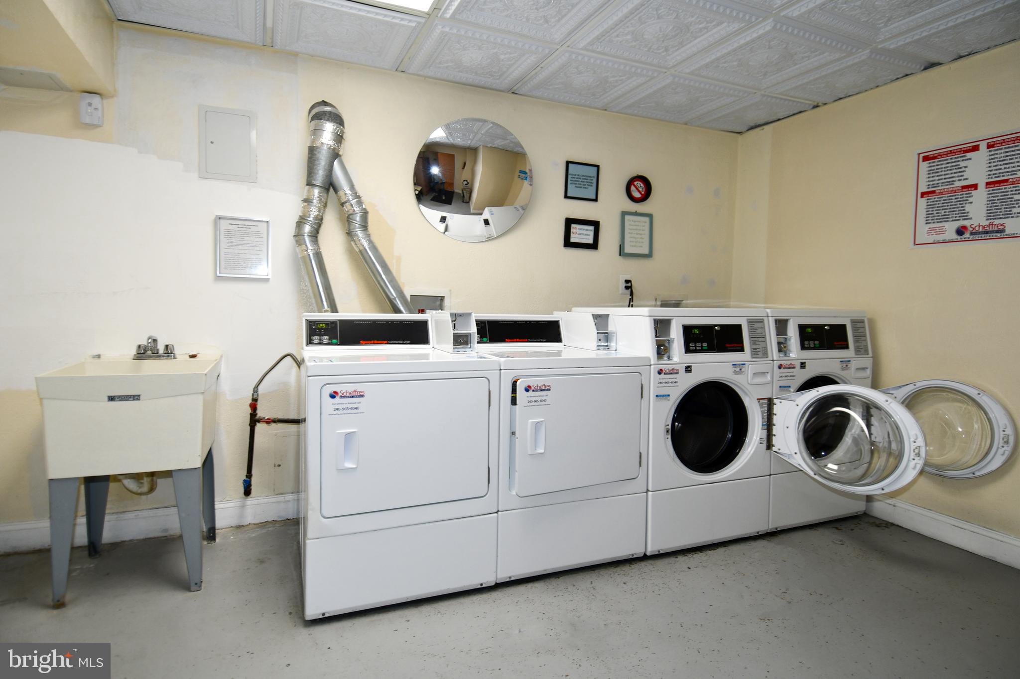 2625 3rd Street Northeast, Unit 301 Washington, DC 20002 - Photo 20 of 21 a utility room with dryer and washer