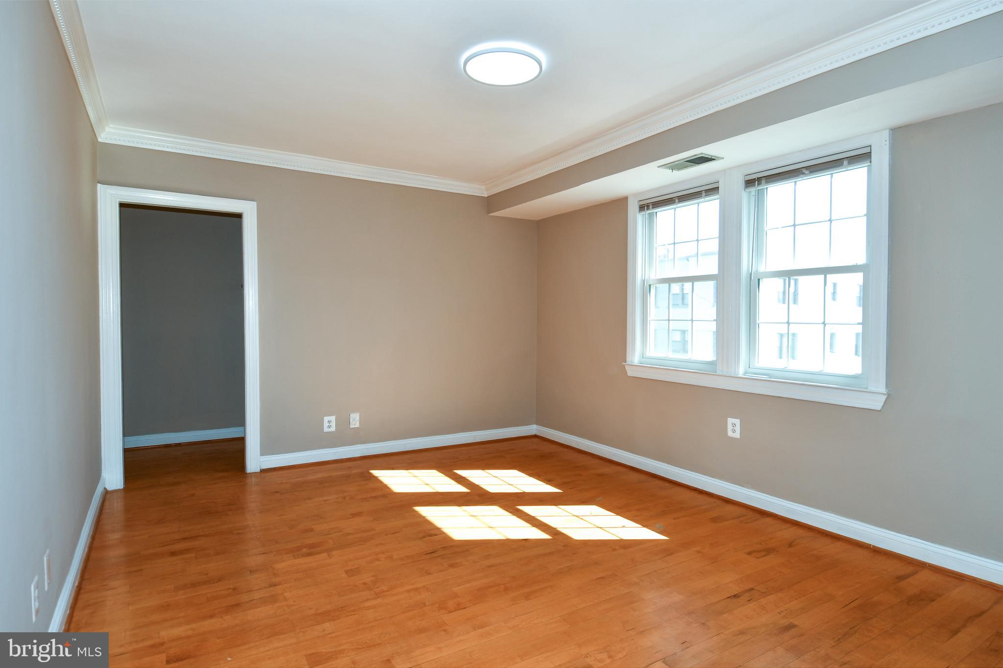 2625 3rd Street Northeast, Unit 301 Washington, DC 20002 - Photo 5 of 21 an empty room with windows
