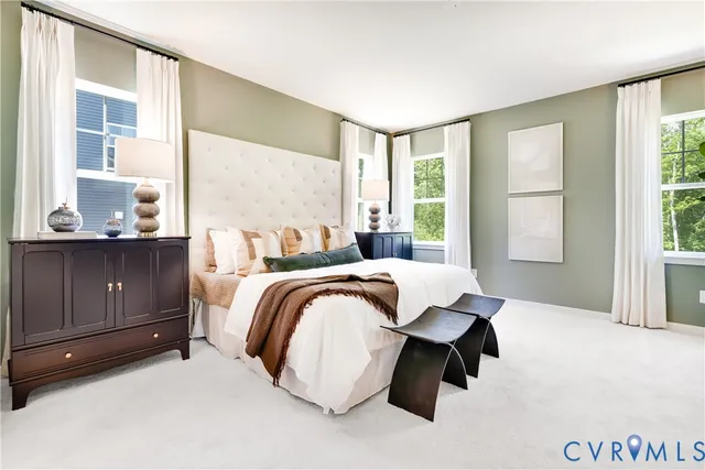 a spacious bedroom with a bed and window