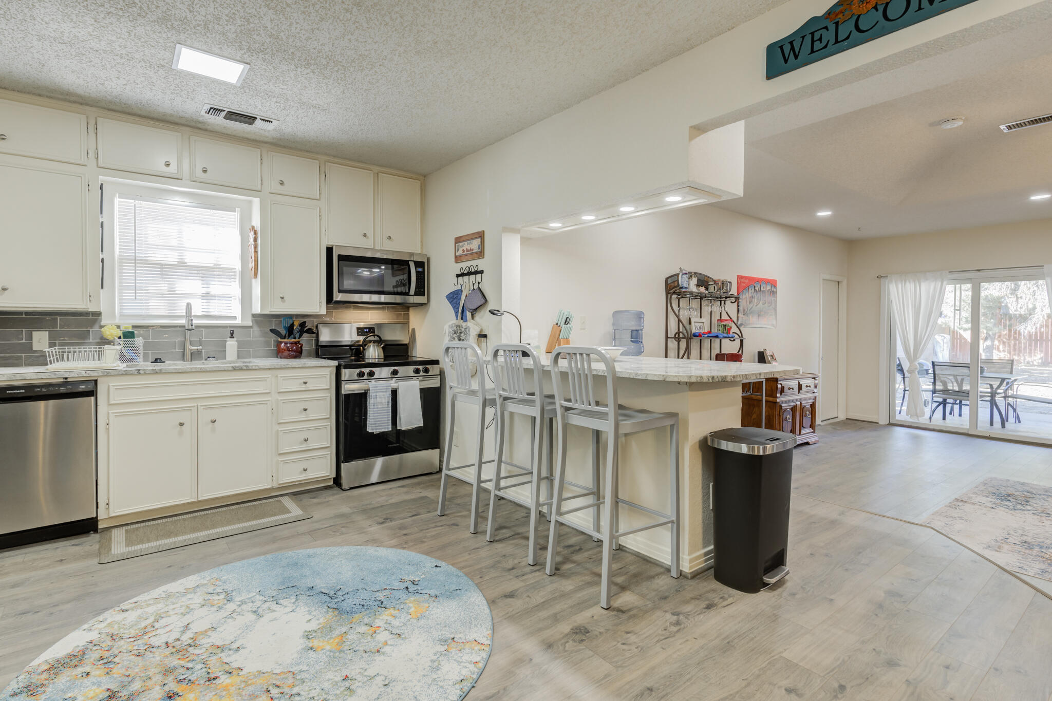 2822 23rd Street Lubbock, TX 79410 - Photo 15 of 39 a kitchen with sink cabinets and window
