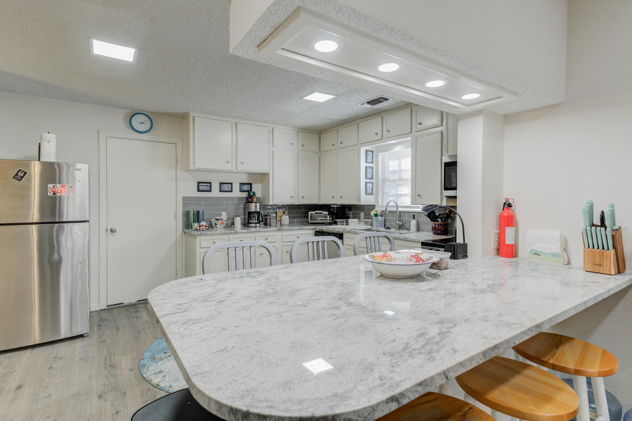 2822 23rd Street Lubbock, TX 79410 - Photo 16 of 39 a kitchen with sink refrigerator and cabinets