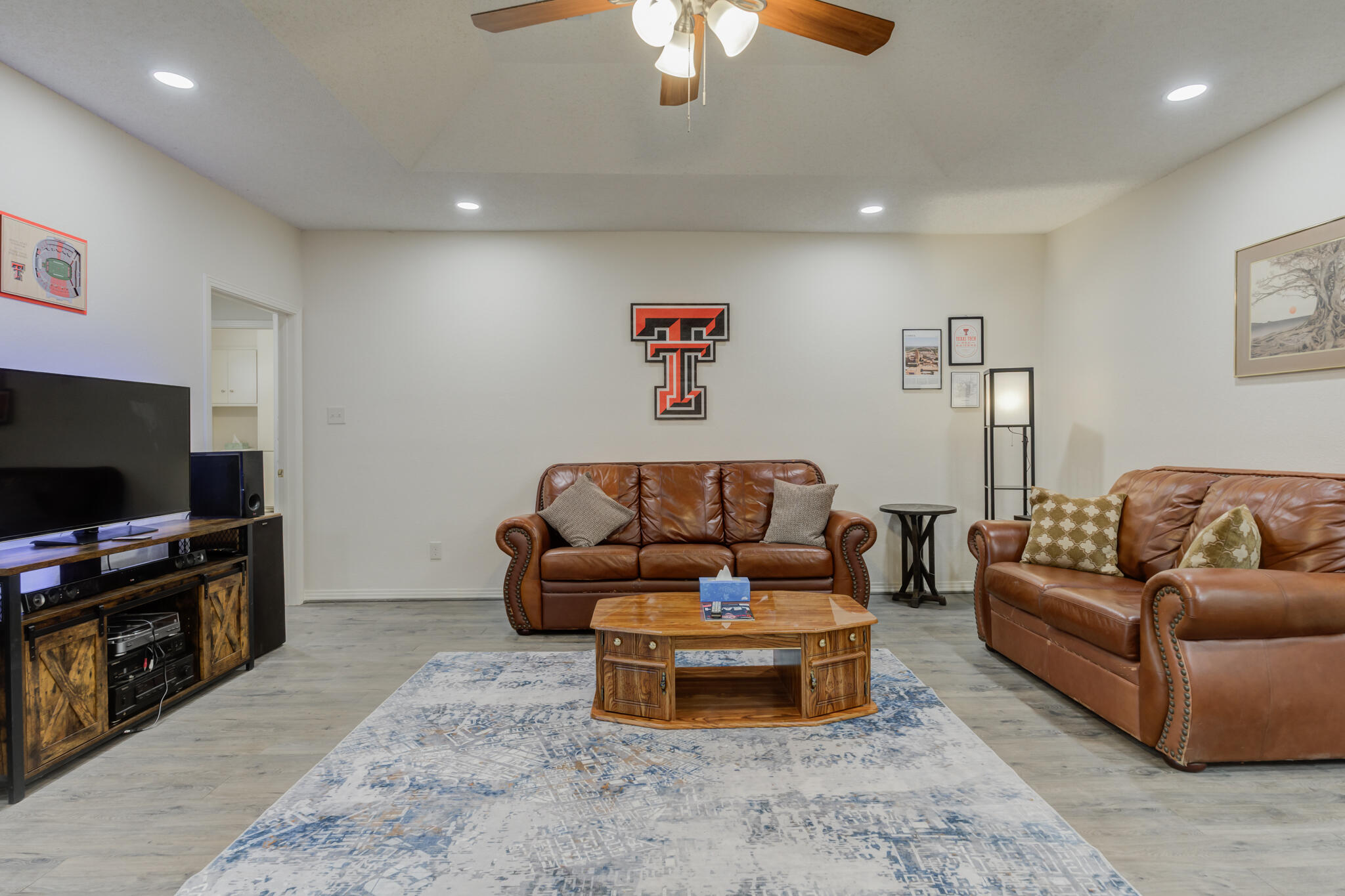2822 23rd Street Lubbock, TX 79410 - Photo 18 of 39 a living room with furniture and a flat screen tv